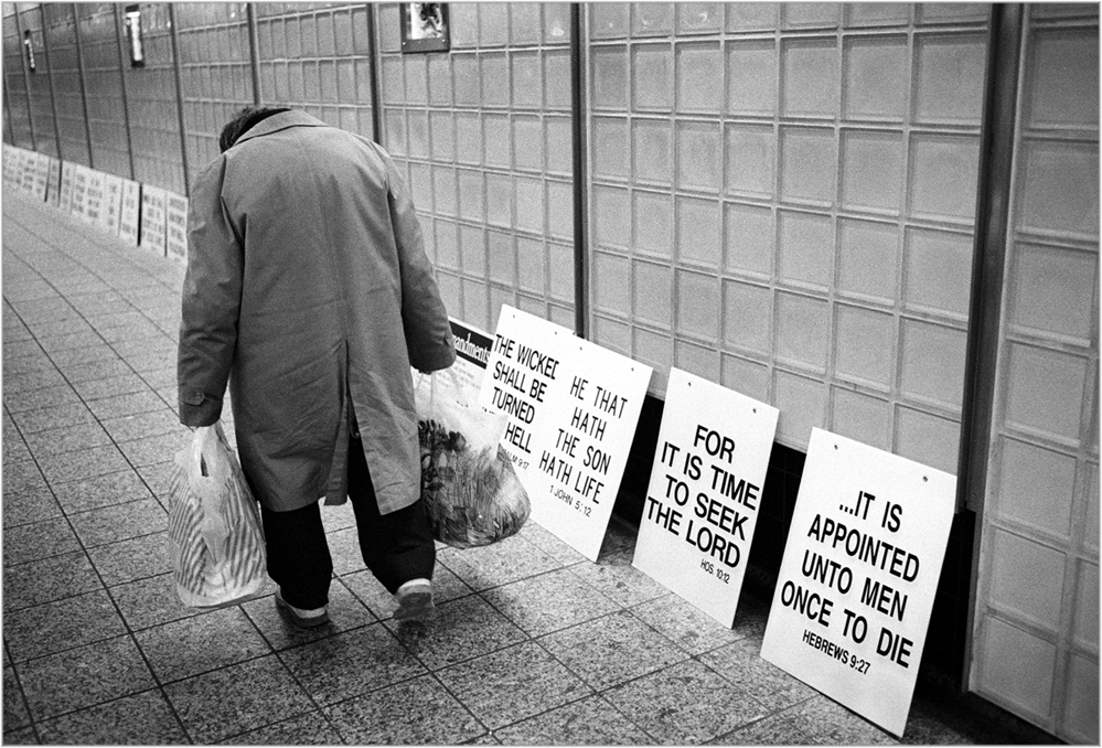 old man walking times square station