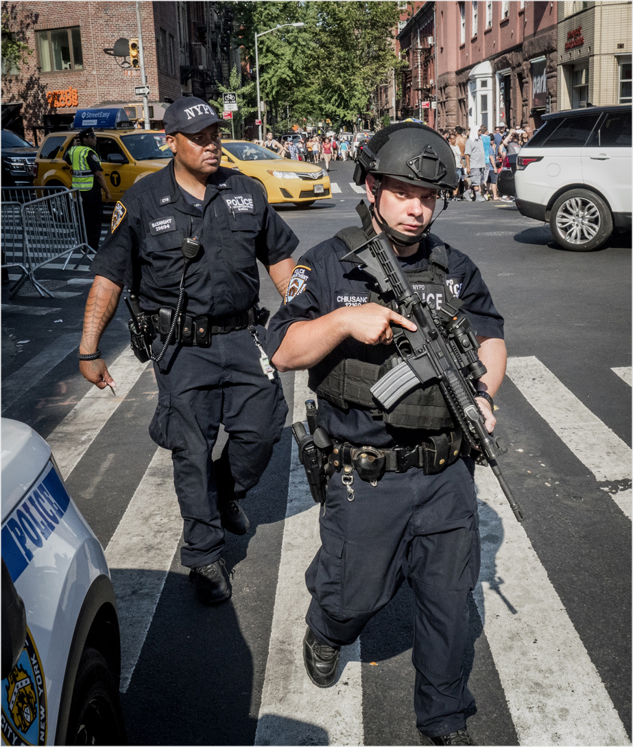 gay-pride-cop-machine-gun-points-copy